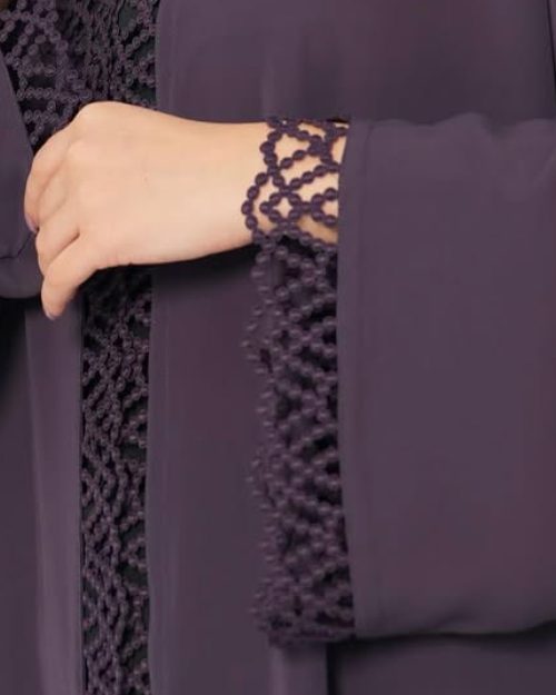 Close-up of lattice lace trim on a plum abaya