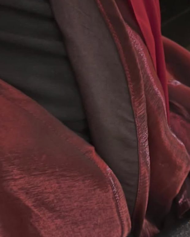 Close-up of a burgundy fabric with a soft sheen