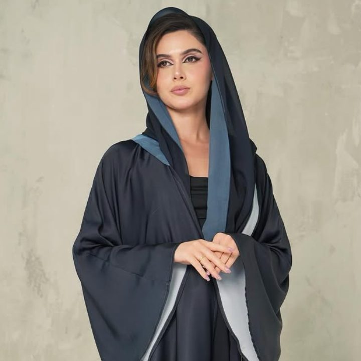 Navy abaya with a floral printed hem and a blue-lined shayla