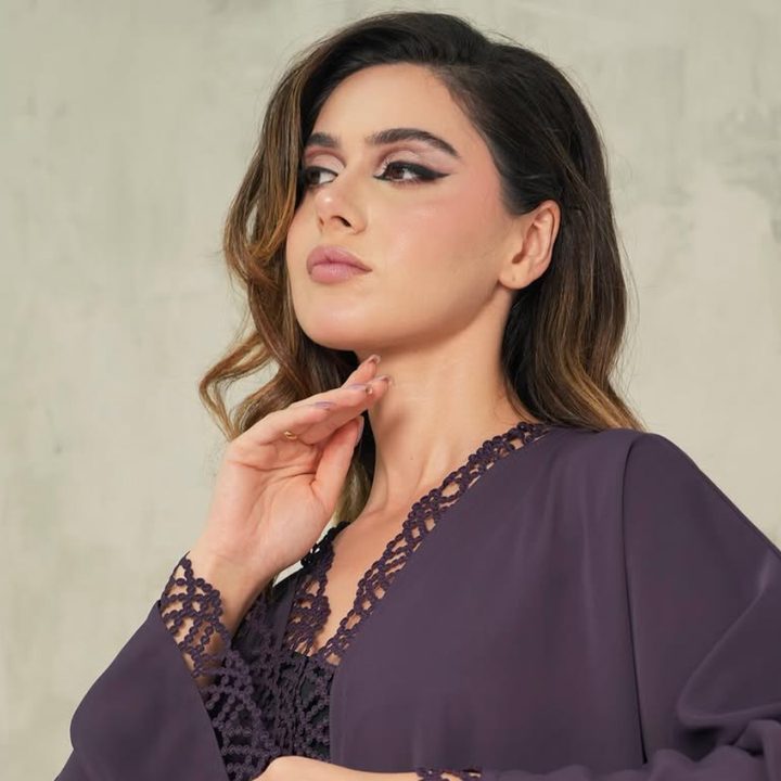 Plum abaya with lattice lace trim along the opening and cuffs