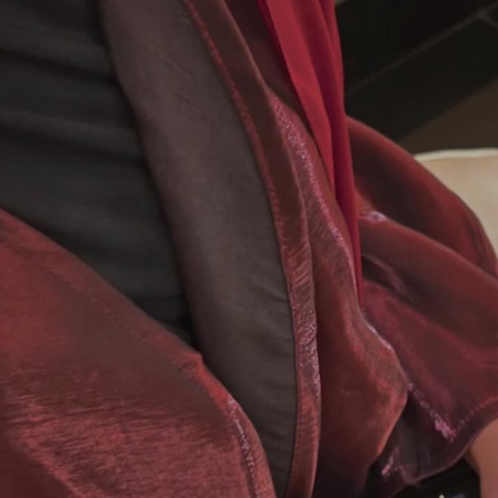Burgundy abaya in a fabric with a soft sheen